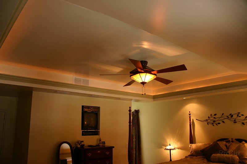 BHG 008.jpg - The tray ceiling is trimmed with cove molding and rope lighting behind it.